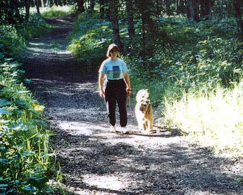 Women walking dog in Russian Jack Park